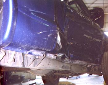 Low and looking toward front from behind door